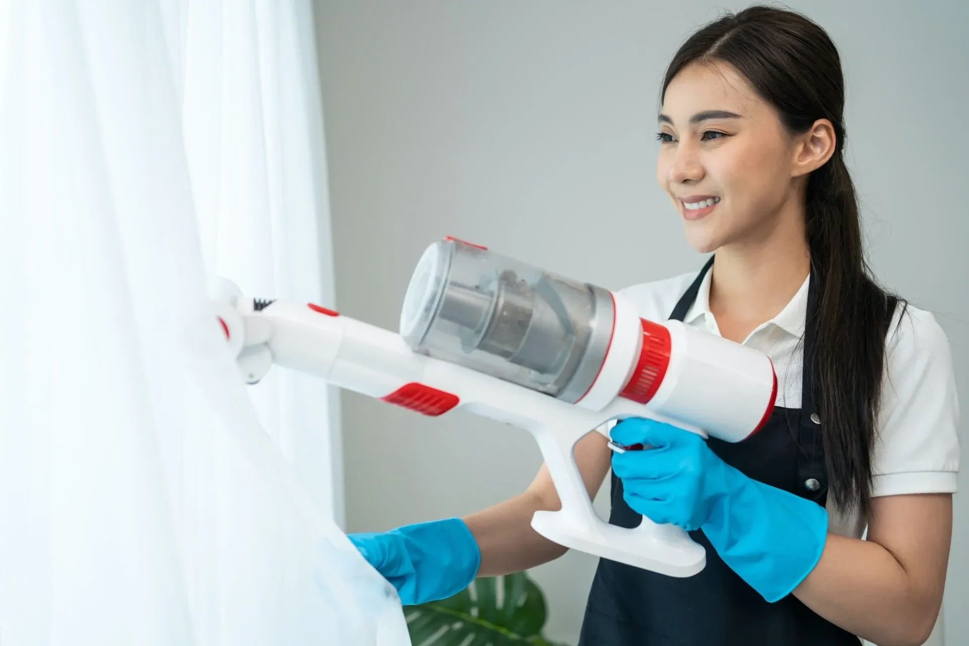 asian-cleaning-service-woman-worker-cleaning-in-living-room-at-home-1-1-e1680687963757